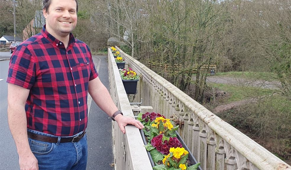 Richard Lovering from Otter Garden Centre Man standing on a bridge in Ottery St Mary