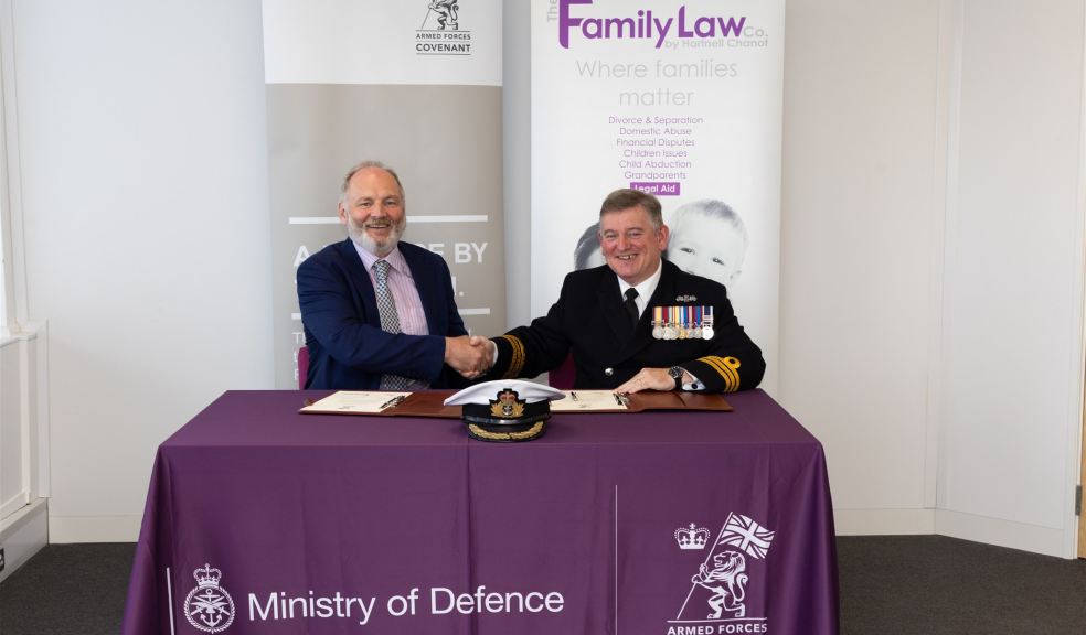 Jonathan Madge and Cdr Stephen Henaghen Handshake between law firm Director and Commander Stephen Henaghen