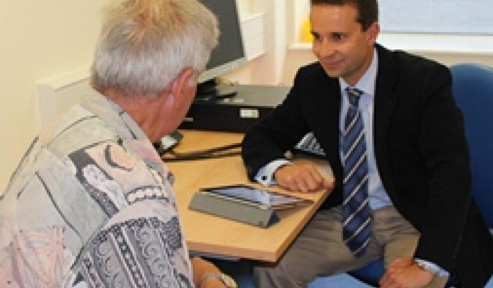 Dr Rupert Noad with a patient