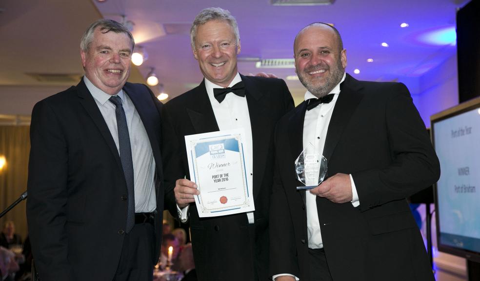 Barry Young of Brixham Trawler Agents receives the Port of the Year Award from Rory Bremner.