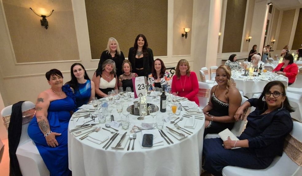 Butterfly Lodge team members at Awards Dinner with manager Clare Sinclair and deputy manager Sarah McCaffrey standing (Clare on LHS) and Teresa Warren (seated 3rd from left) Butterfly Lodge team members at Awards Dinner with manager Clare Sinclair and deputy manager Sarah M
