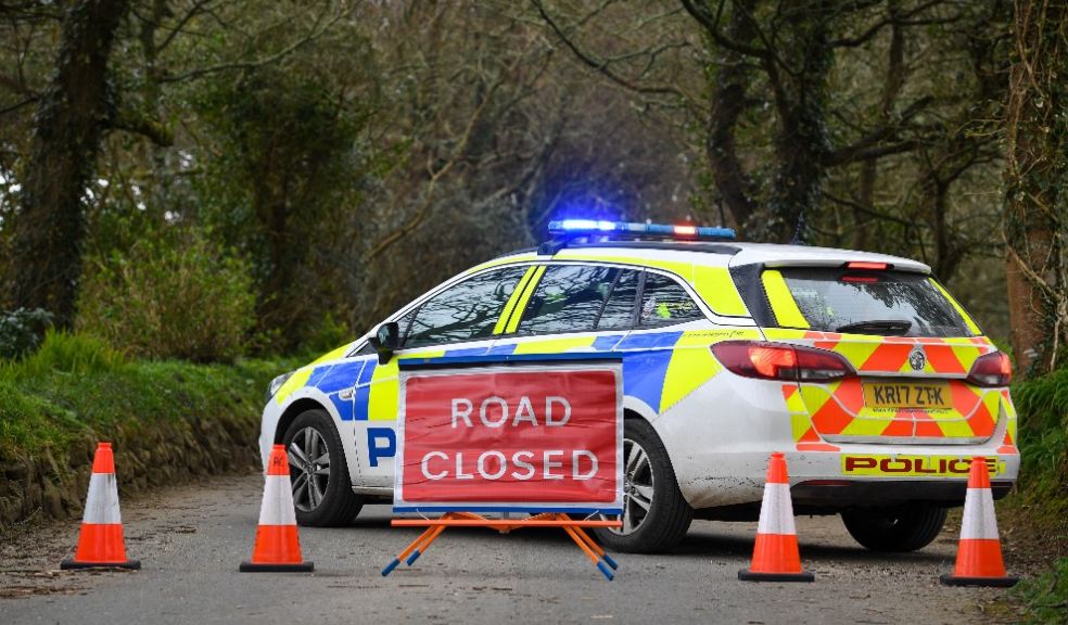Devon & Cornwall Police car featuring 'road closed' sign