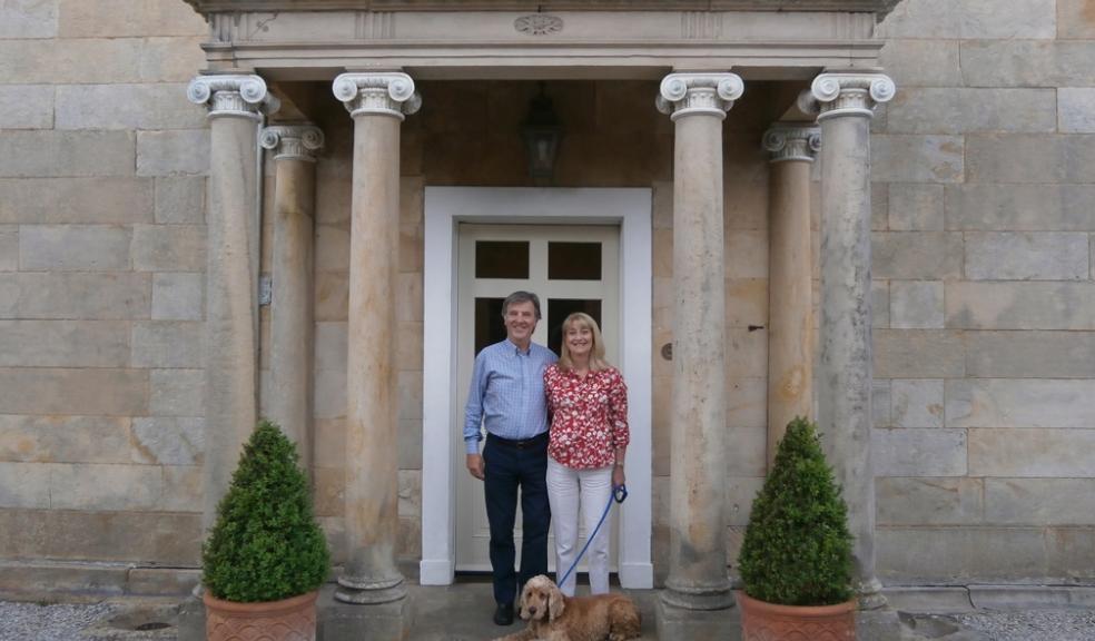Guy and Julie Vass with Toby the dog at front door of Melling Hall Melling Hall