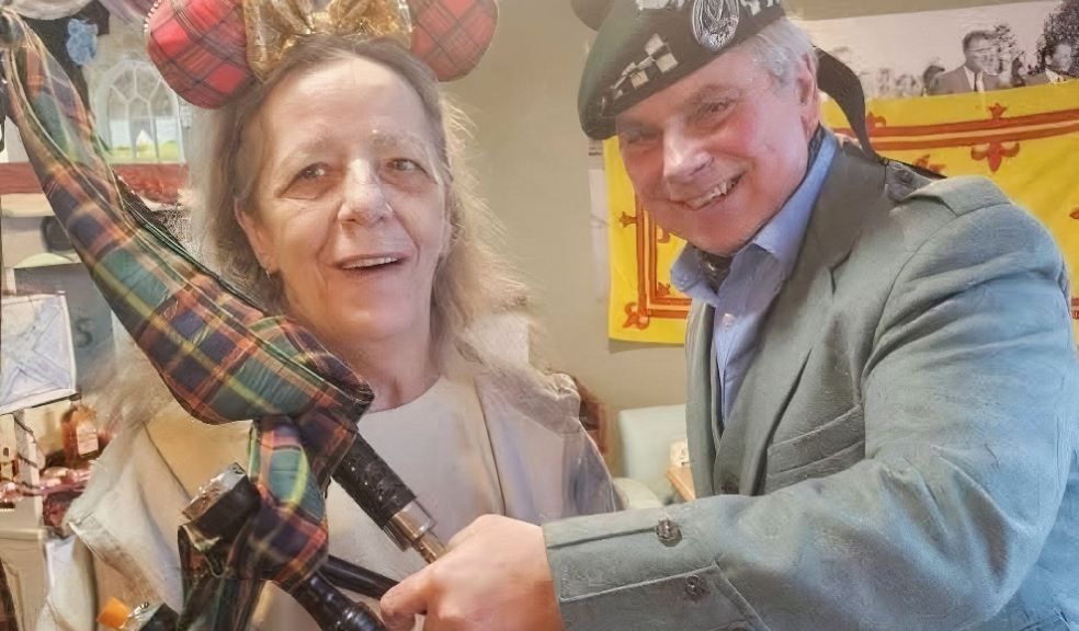 Heather Whitford with Dave the Lone Piper at Butterfly Lodge