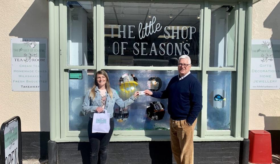 Competition winner, Hollie Broom with Roger Hemming from Roger Hemming Estate Agents, outside The Little Shop of Seasons in Honiton
