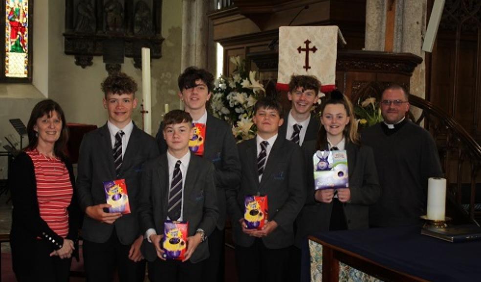 Photo caption: Left to Right: Julie McGlinchey (school librarian), Jake Proctor, Connor Docking, Toby Diston, Louis Shearstone, Kiel Hilton, Shayla Hilton and Father Will Sweeney.