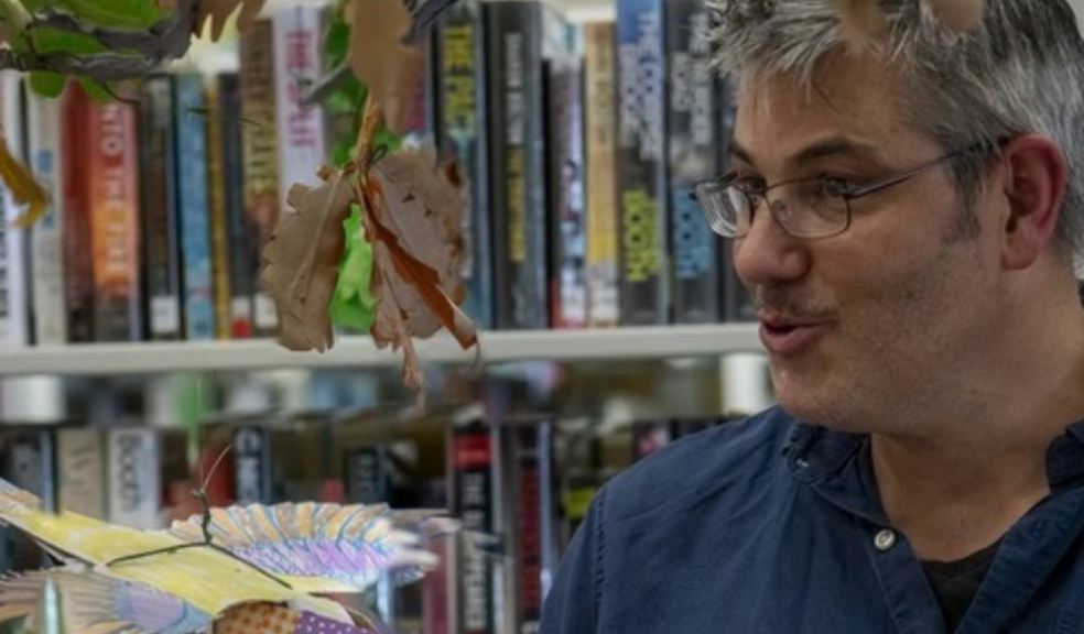 James stood in front of library books