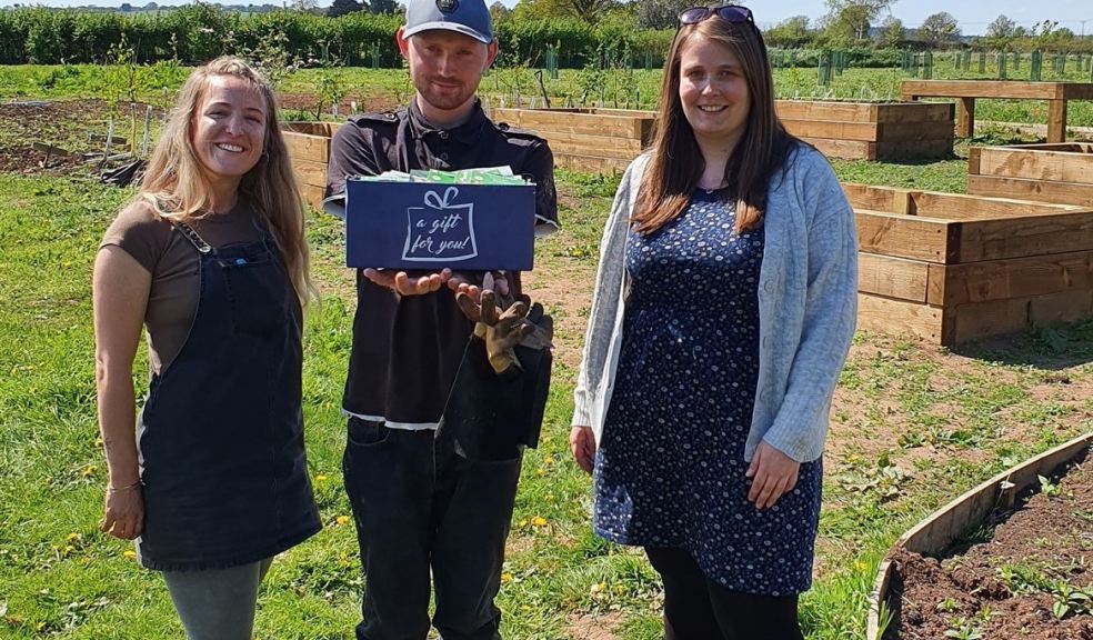 Jasmine Littlejohn, Stephen Morbey, Chris Amphlett Handing over the box of seeds