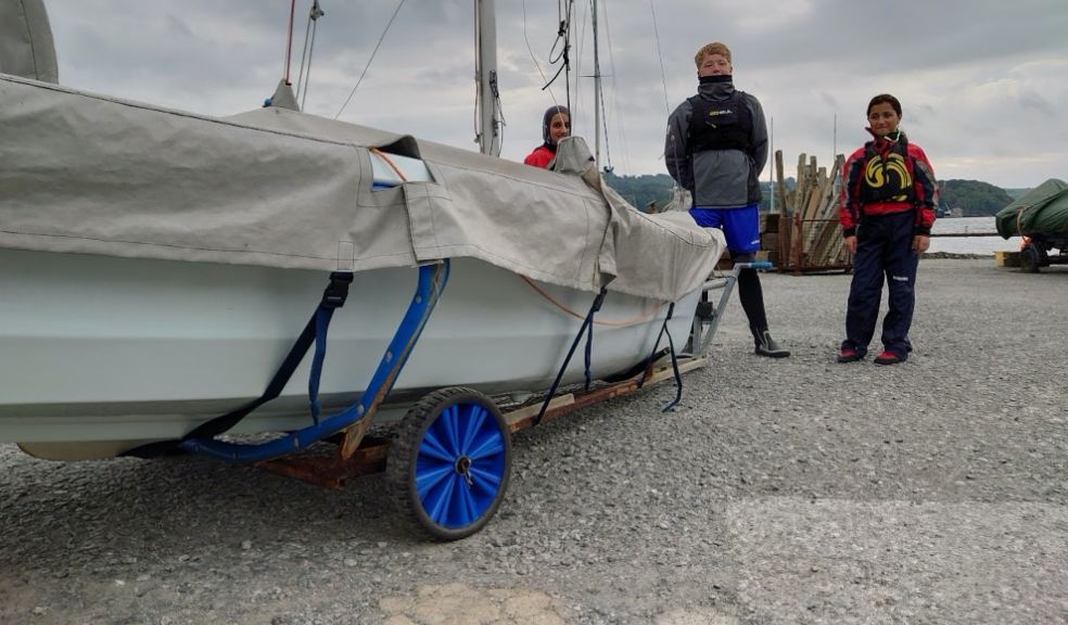 One of the ‘Horizons’ dinghy trailers equipped with new wheels with Plymouth young people looking on (image courtesy of ‘Horizons’ Plymouth Children’s Sailing Charity)