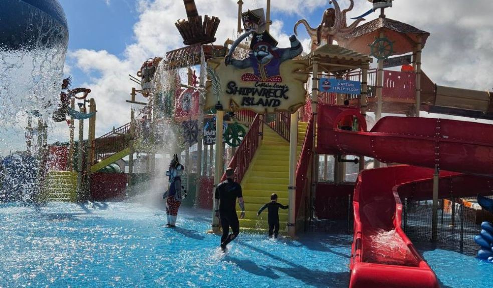 Shipwreck Island Aquaplay Boy and father at pirate waterpark play structure, Splashdown Quaywest