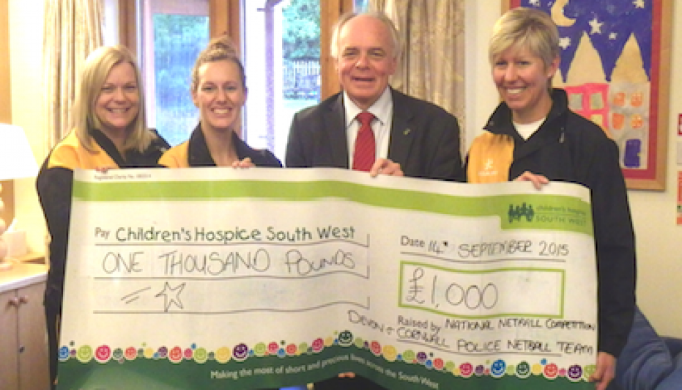 L to R: Cat Irwin, Amy Tresidder, CHSW CEO Eddie Farwell CEO and PC Sarah Harvey from Devon & Cornwall Police Netball team present fundraising cheque for £1000