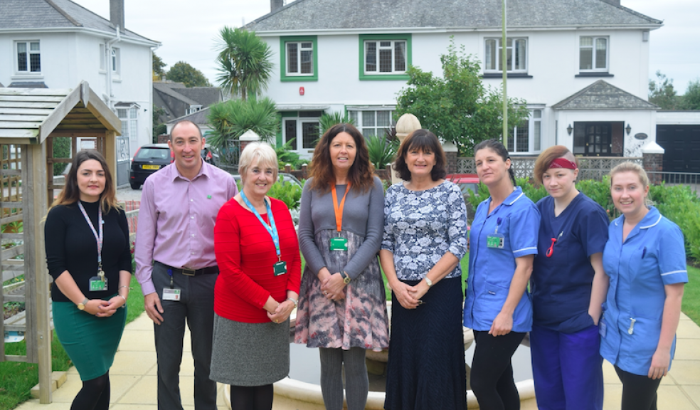 Councillor Lynda Bowyer, Cabinet Member for Health and Adult Social Care with Francesca Fletcher, Manager at Durnsford Lodge Care Home, and Cllr Lynda Bowyer meeting with the team at Durnsford Lodge and Council staff. Both photos are in the garden at Durnsford Lodge which was one of 18 homes that received a share of £150,000 in improvement grants.