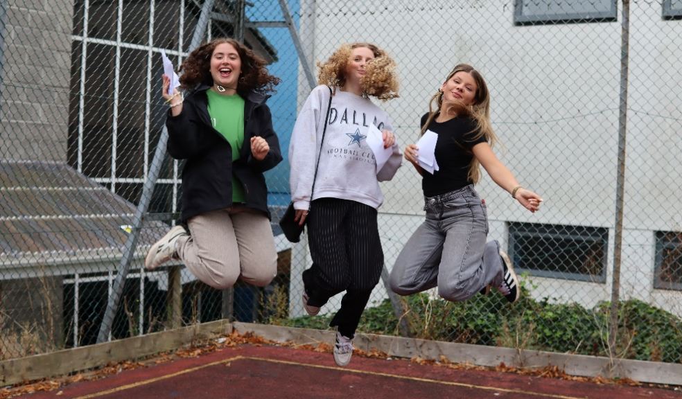 Sky high happiness. students jump for joy as they revel in their A-Level success