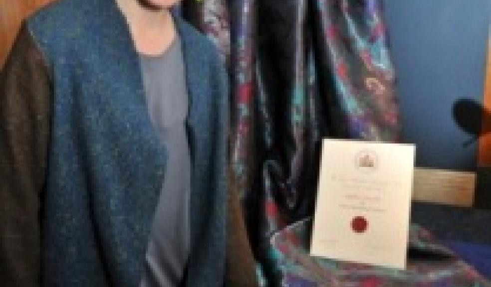 Sophie Zajicek with her award and designs