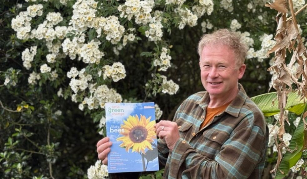 Devon schools featured in eco magazine Toby Buckland holding an eco magazine