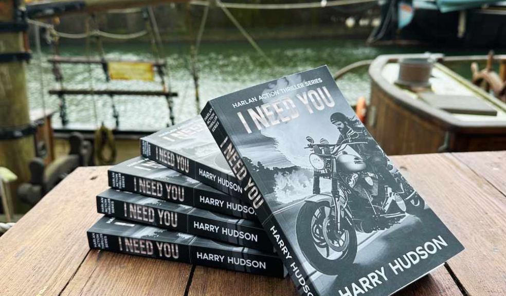 Five copies of I Need You by Harry Hudson on a table at Charlestown Harbour