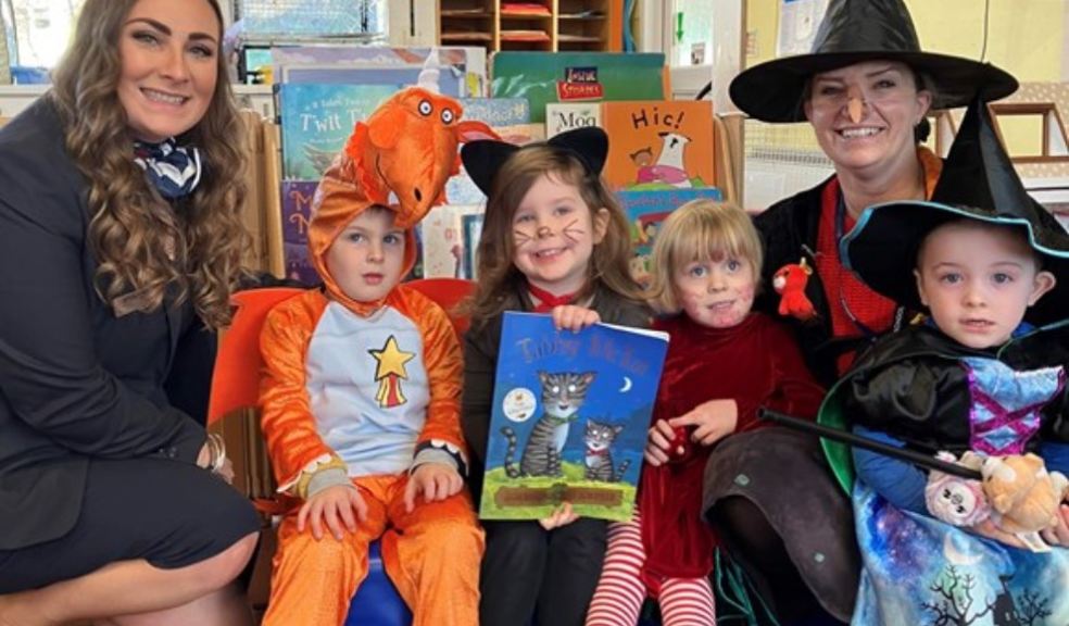 Stowford School nursery children and staff pictured with Sales Advisor Hayley Williams to celebrate World Book Day – and a donation from Bloor Homes.