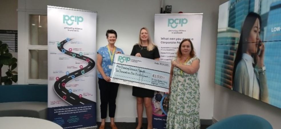 Plymouth charity receives donation from Yorkshire building society Charity members holding a cheque for PCIP