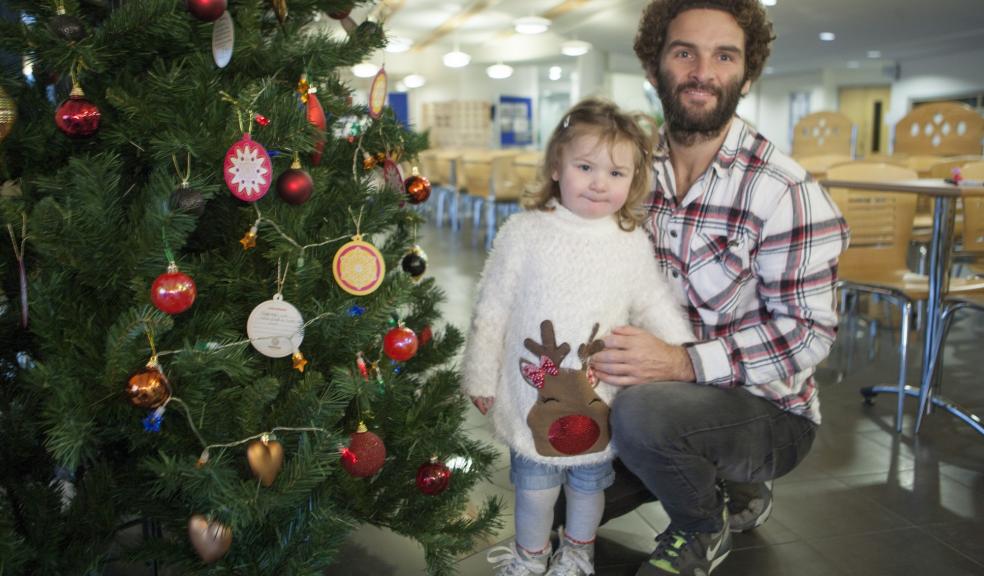 Marcus Cronin and his daughter Florence have launched the Brain Tumour Research Christmas appeal at Plymouth University, in remembrance of wife and mother Caroline who died from a brain tumour.