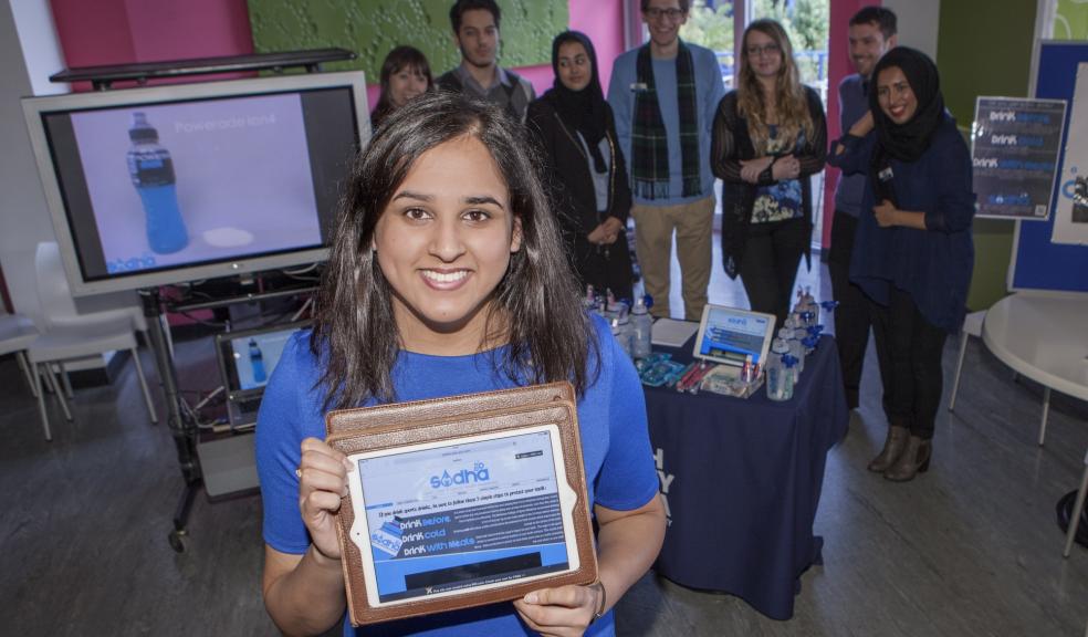 Dental students present their website on the dangers of hidden sugar in energy drinks and snacks