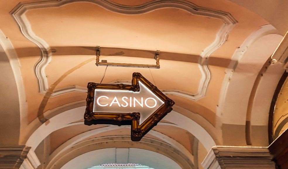 A casino sign hanging from the ceiling.