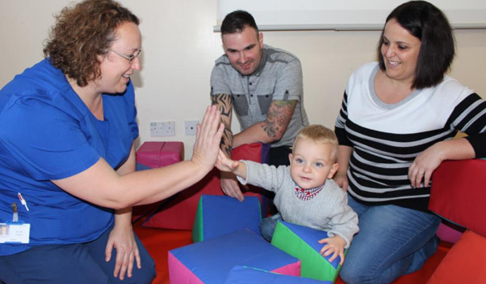 Katie Oakes, Unit Manager with baby Harry and his parents Alan and Rachel