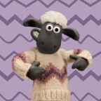 Shaun the sheep wearing a knitted jumper