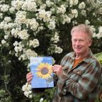 Toby Buckland holding an eco magazine