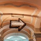 A casino sign hanging from the ceiling.