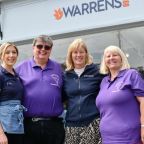 Warrens and dementia awareness people stood outside of warrens