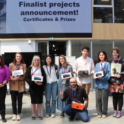 Group of young people holding prizes