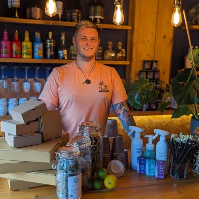 Owner of Aquarius Bar with some of the eco friendly products used