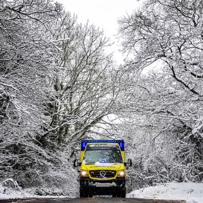 A SWASFT ambulance responding to a call in the snow. 