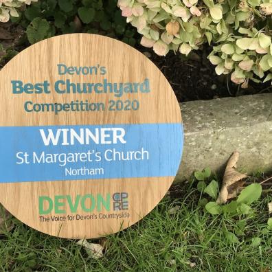 Plaque for last year's winner of Devon's Best Churchyard