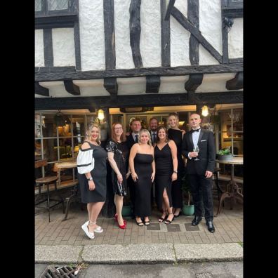  Bayards Cove Inn team celebrating their win at the 2024 Food Drink Devon Awards for Best Pub, showcasing their commitment to local cuisine and excellent service.