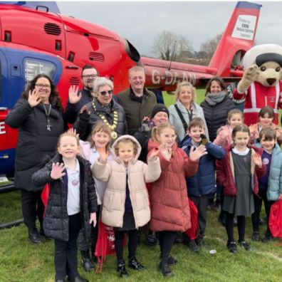 photo of Devon Air Ambulance with people standing next to it