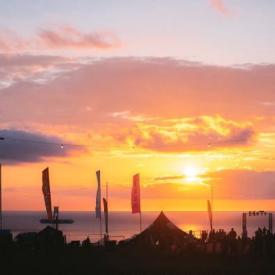 Beautiful sunset of orange and yellow colours over the beach