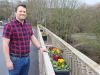 Man standing on a bridge in Ottery St Mary