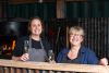 Two women enjoying a glass of fizz