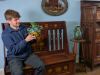 Cataloguer Barnaby Willis with examples of Brannam Pottery and Shapland and Petter furniture
