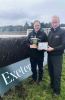 General Manager Jack Parkinson and Clerk of the Course Jason Loosemoore with The Mousetrap Cup Trophy and a photo of Agatha Christie at Exeter Racecourse