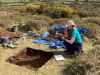 woman digging in dartmoor archaeological dig