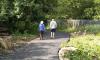 Couple walking along traffic-free pth