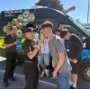 Teen using a breathalyser with the police