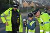 Two policeman with child and traffic speed gun
